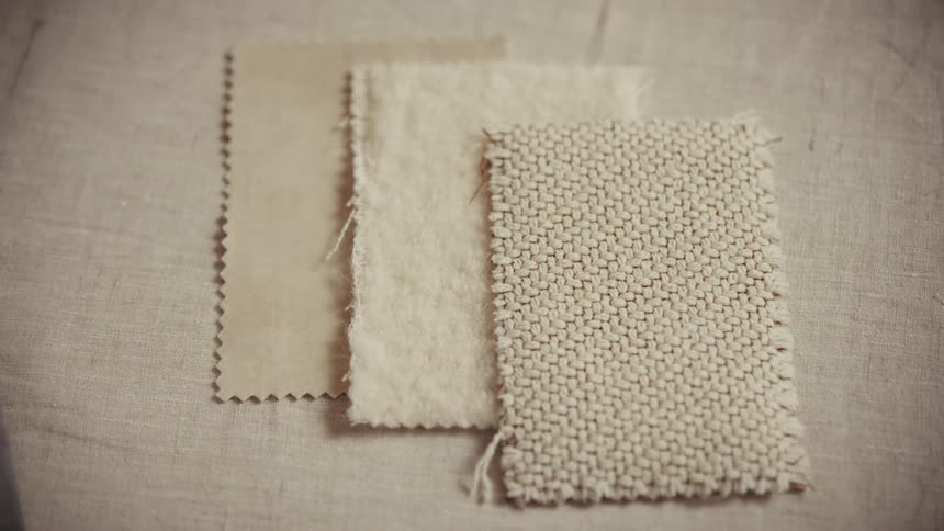 Patches of cloth with different textures and colors indoors