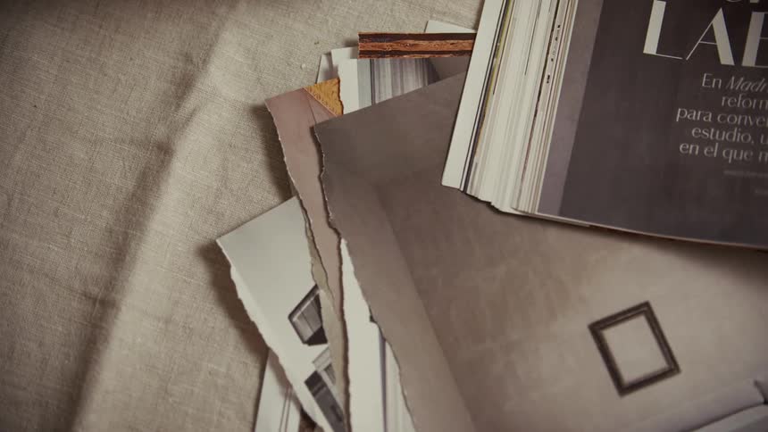 Magazines and paper samples on light fabric