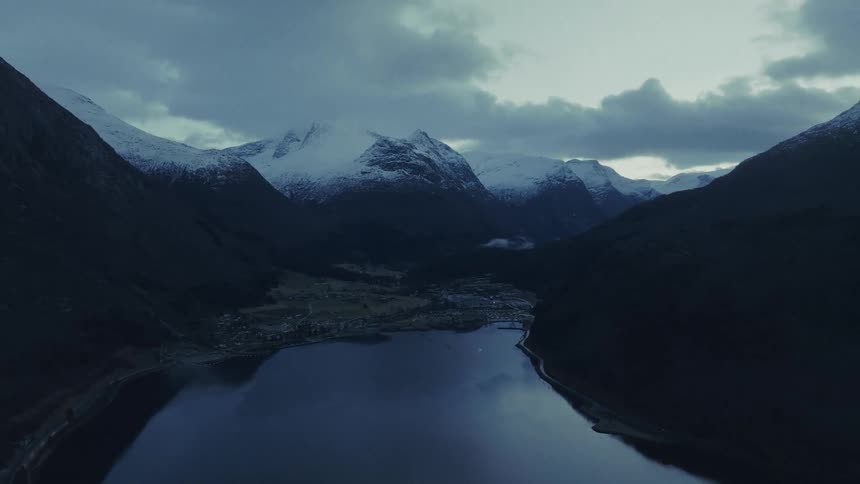 An aerial view of a landscape with lakes an mountains
