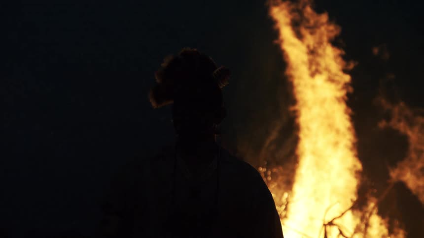 A large bonfire outdoors at night