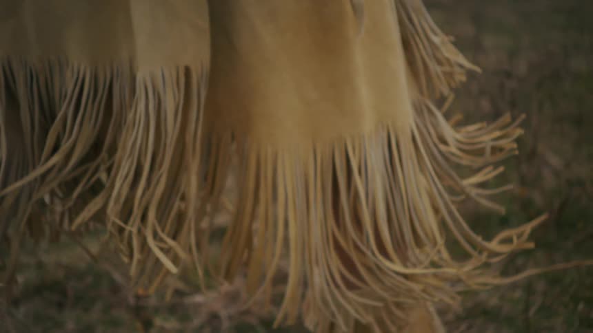 Leather clothing with fringes in outdoor setting