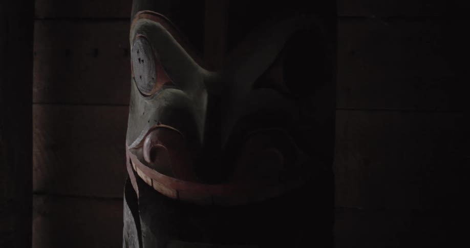 A totem pole sitting in a room