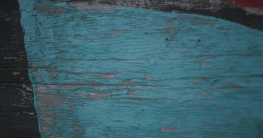Bluetoned artwork on a wooden wall