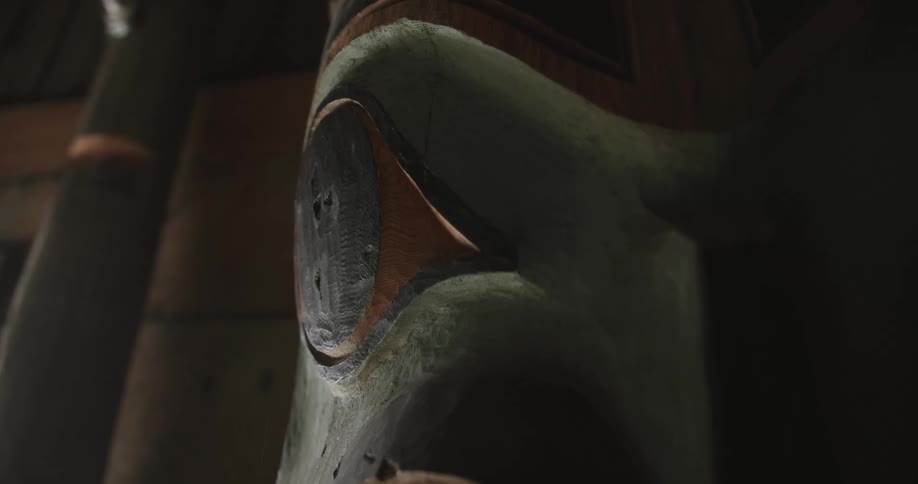 Carved wooden totem with eye detail