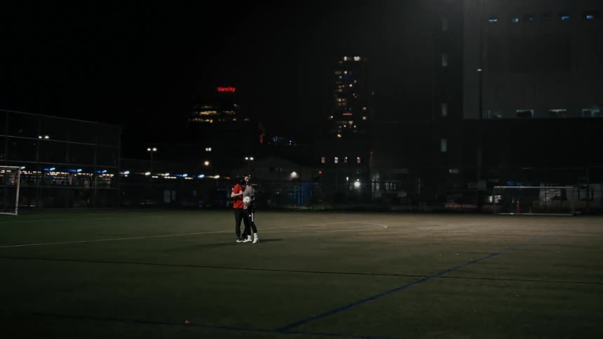 Two soccer players talking with each other