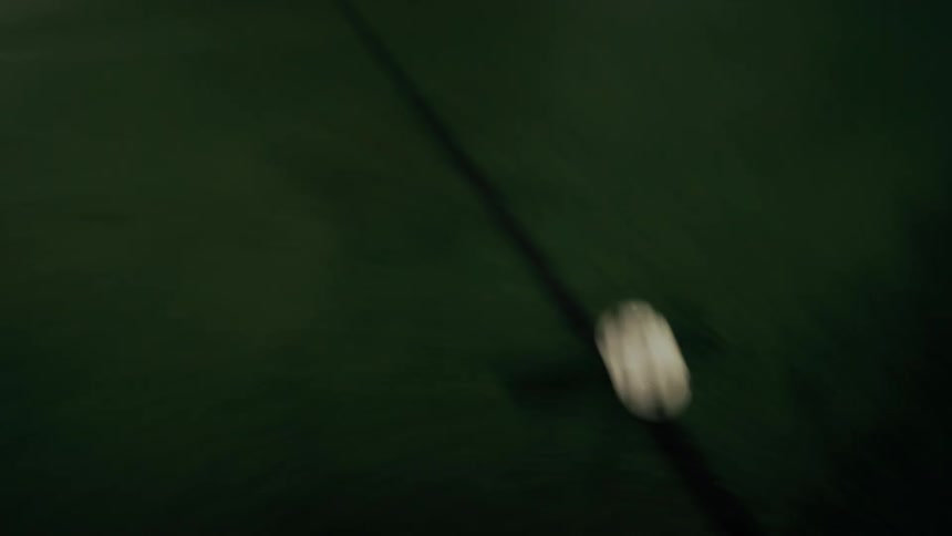 A person kicking a soccer ball outdoors