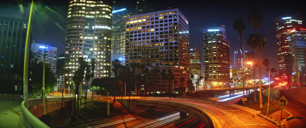 Illuminated buildings and roads with vehicle light trails at night