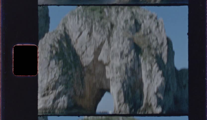 Rock formation with a natural arch over the sea