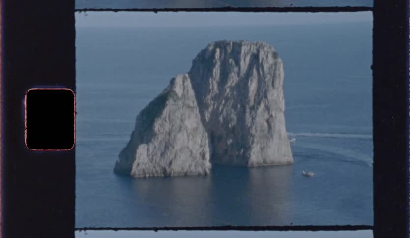 Isolated rocky island in calm sea