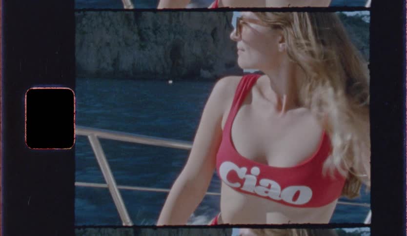 A woman on a boat on a sunny day