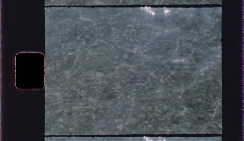 Water surface with small ripples and light reflections