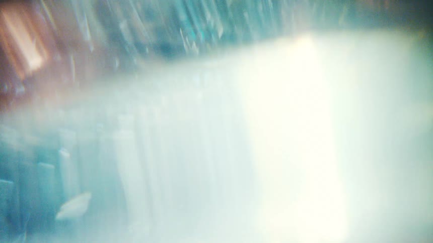 A close up of some flashing lights on glass