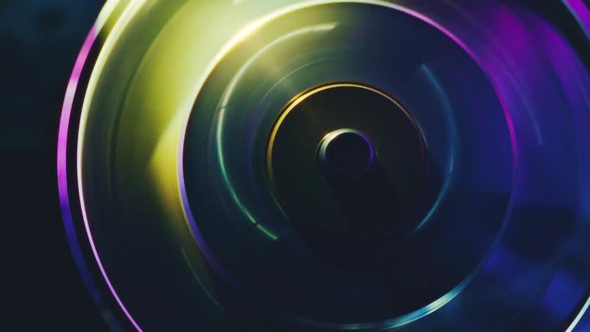 Bright colored light illuminates a spinning disk