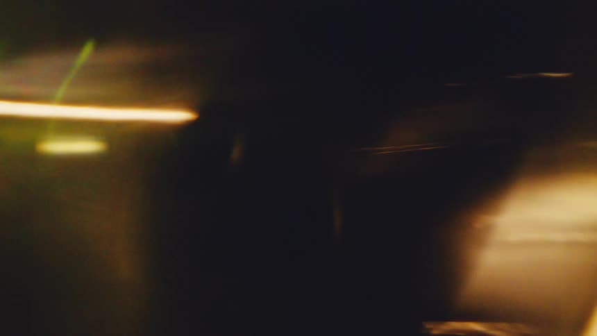 A reflective gold objects spins incredibly fast and is a blur
