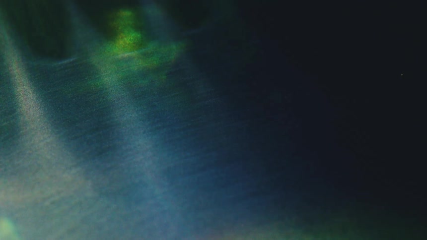 Light beams passing through suspended particles in a dark environment