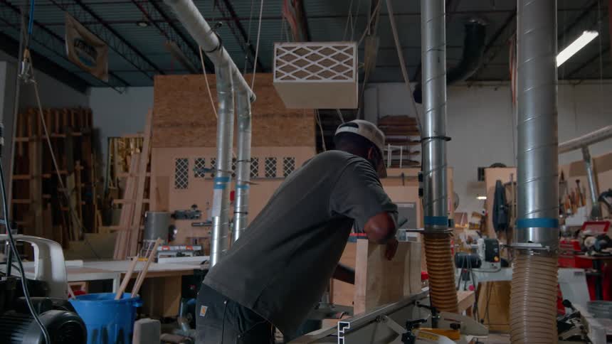 A man working with wood in a shop