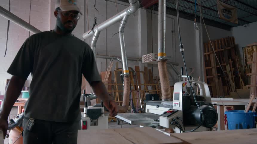 A man working in a wood shop