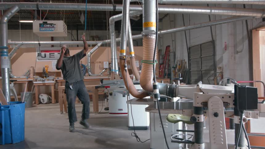 A man working in a wood shop