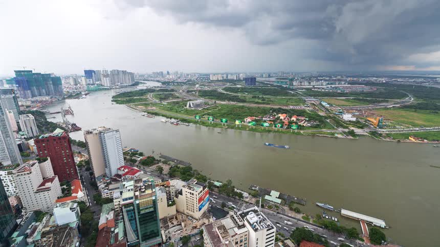 A time lapse of a river next to a big city