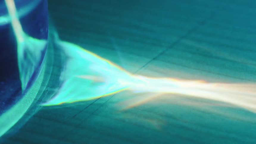 Blue flames illuminaating a dark area