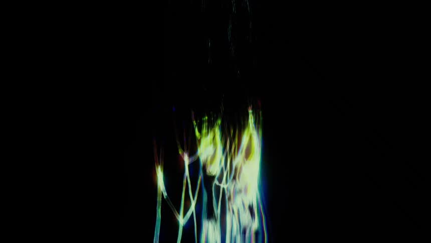 Glowing green and yellow digital lines arranged in a geometric circuit pattern pulse and shift against a solid black background