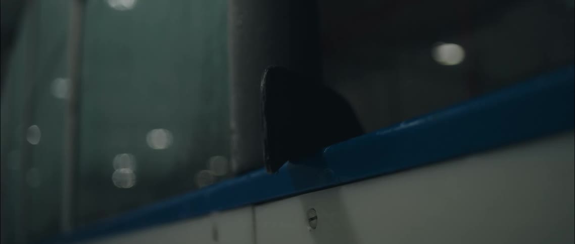 A hockey stick leaning against a wall in a room