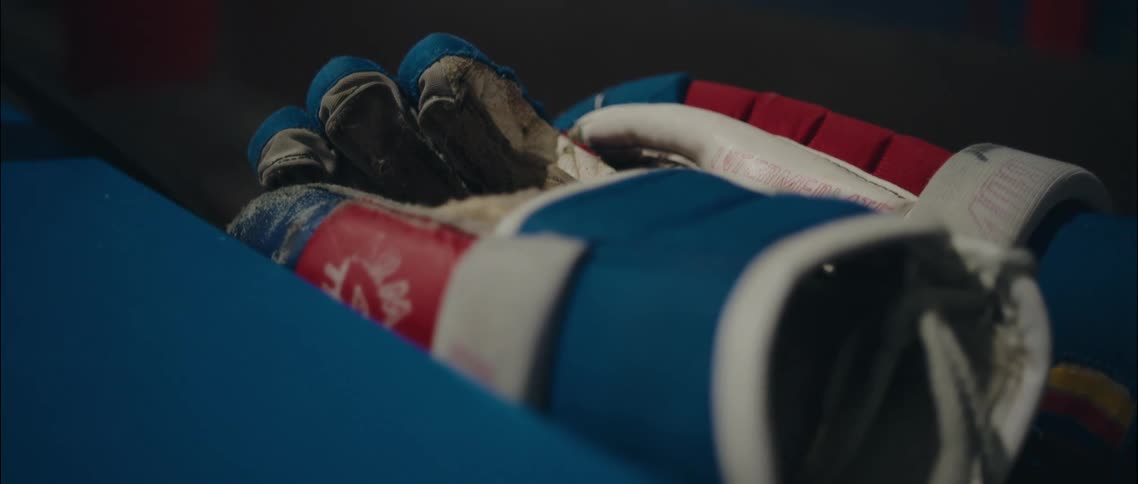 Sports gloves are laying on the surface