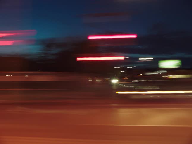 A view of a city at night with lit buildings