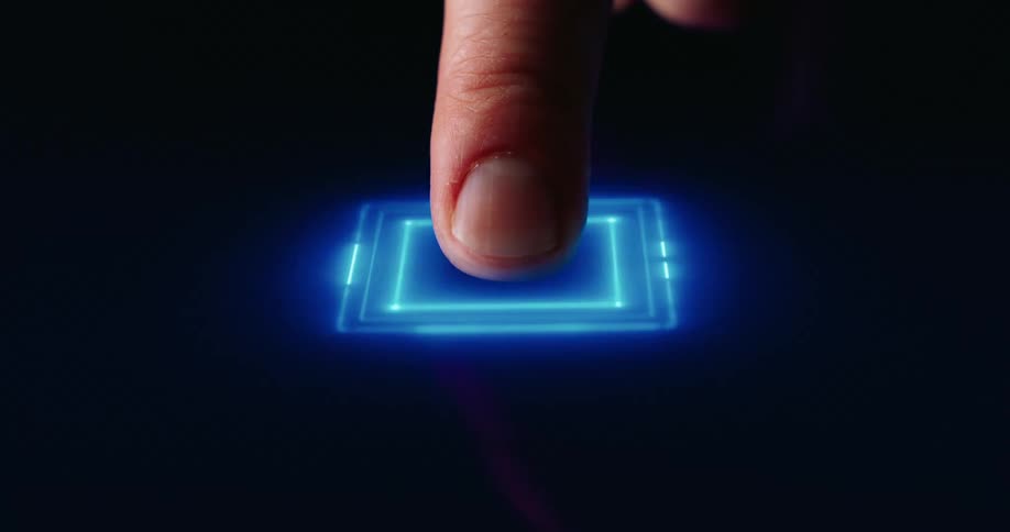 Finger pressing a glowing chip on a blue circuit board