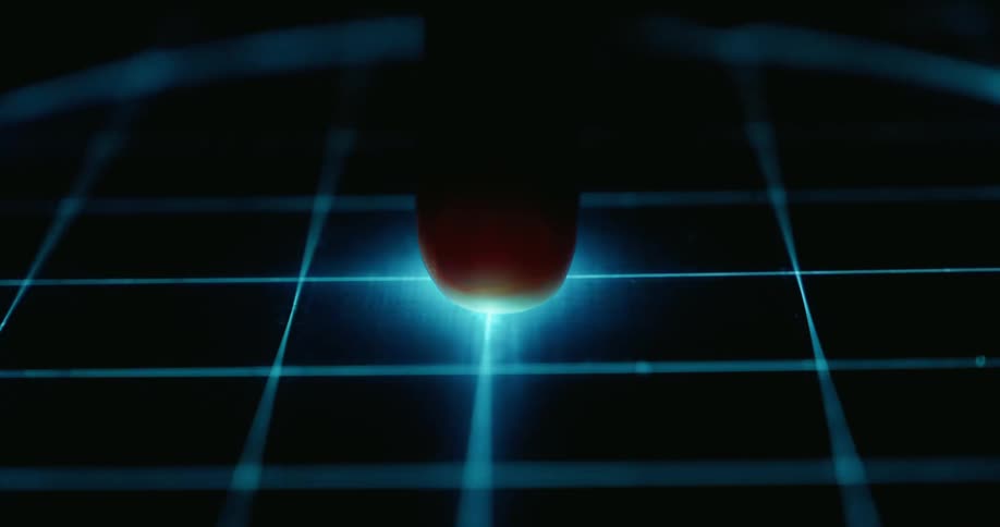 A close up of an animation of lights making a grid and circuit shape