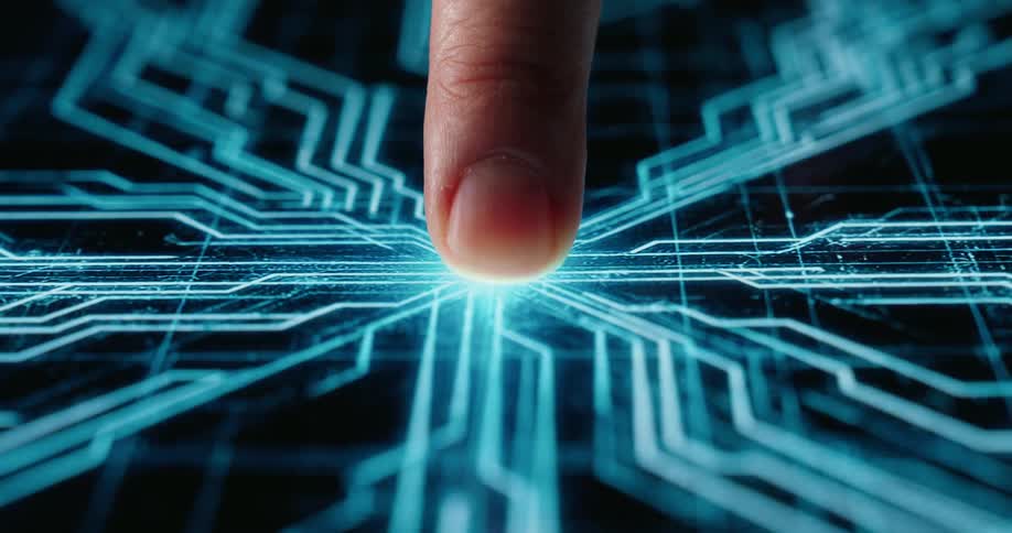 A finger touches a screen and a digital image of circuits appears