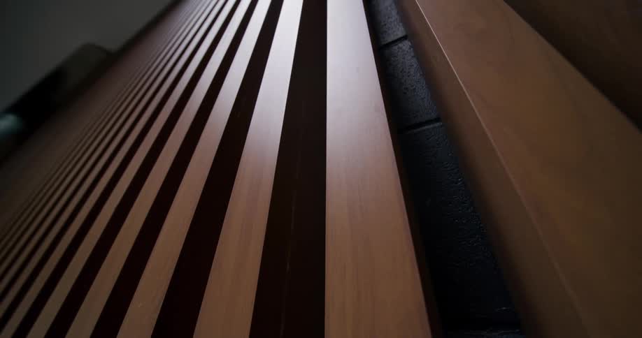 Wooden slats aligned forming a linear pattern in perspective