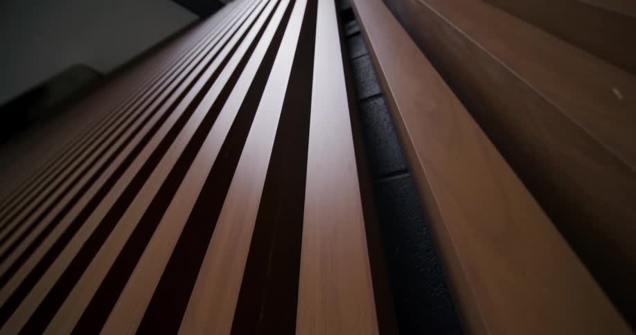 Rows of wooden slats aligned forming parallel lines in perspective