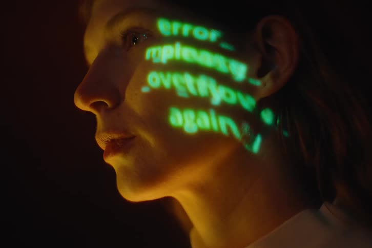 Profile of a woman with the glowing text