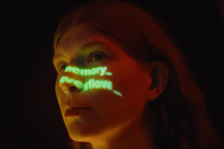 A portrait of a woman with text on her face