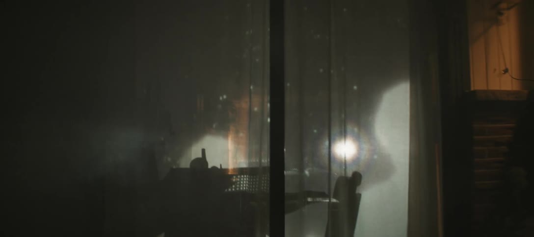A view of some lights in a room aginst a sliding door