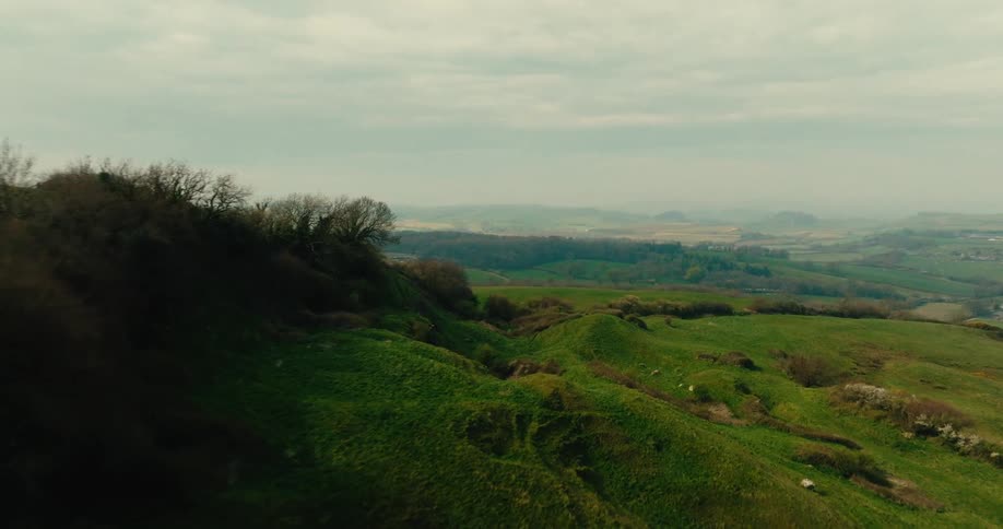An aerial view of some hills on a sunny day