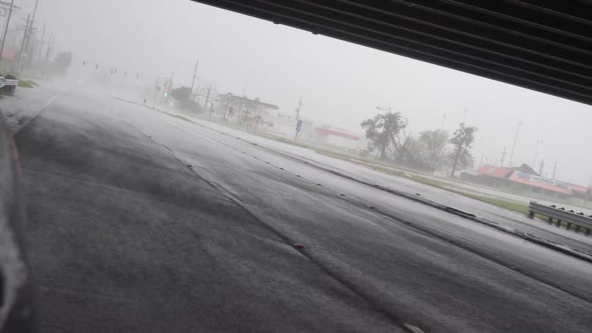 A view of a storm from under an overpass