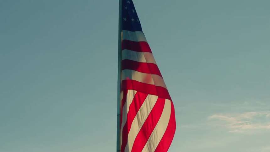 A flag flutters during the day