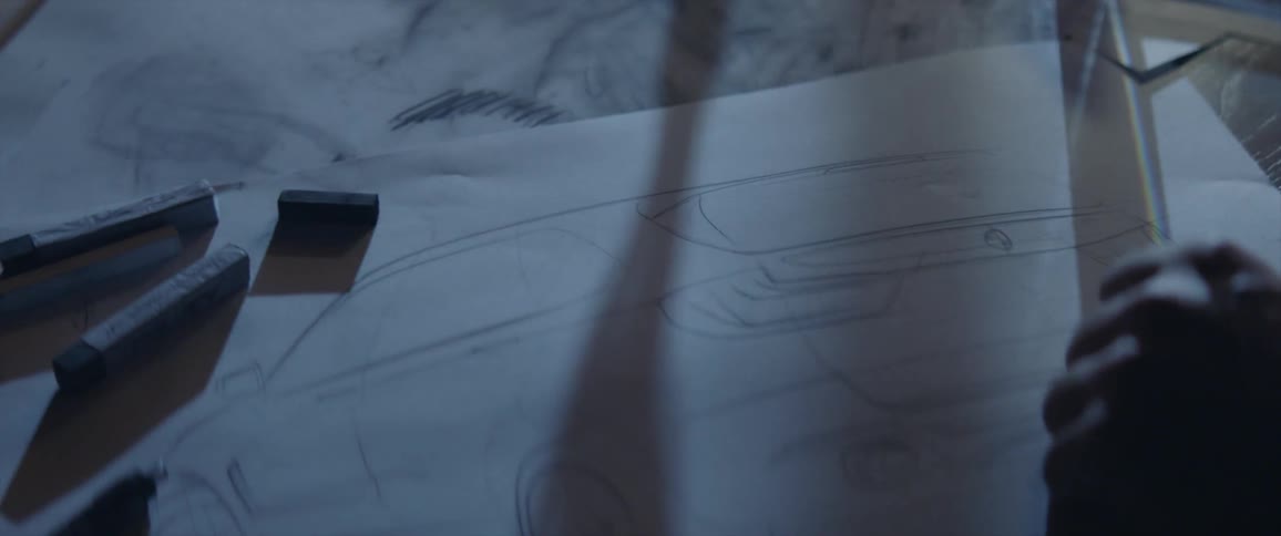 Light flashes on a drawing of a car