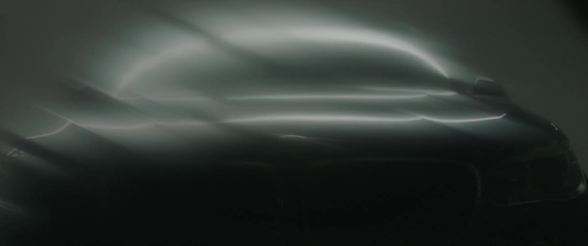 Light shining on a metallic looking material that is bending