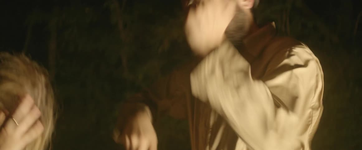 A strobe light flashes on a dancing man