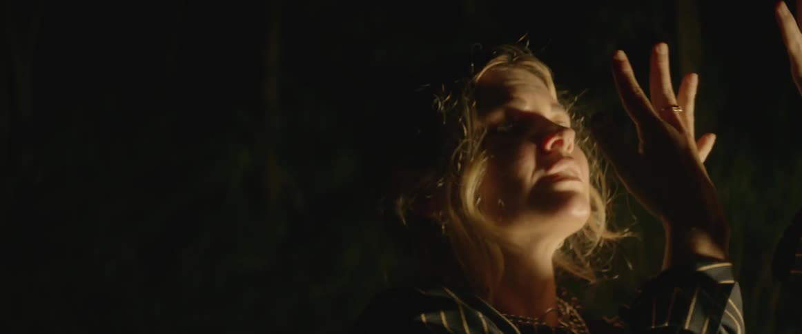 Lights flash on a woman's face