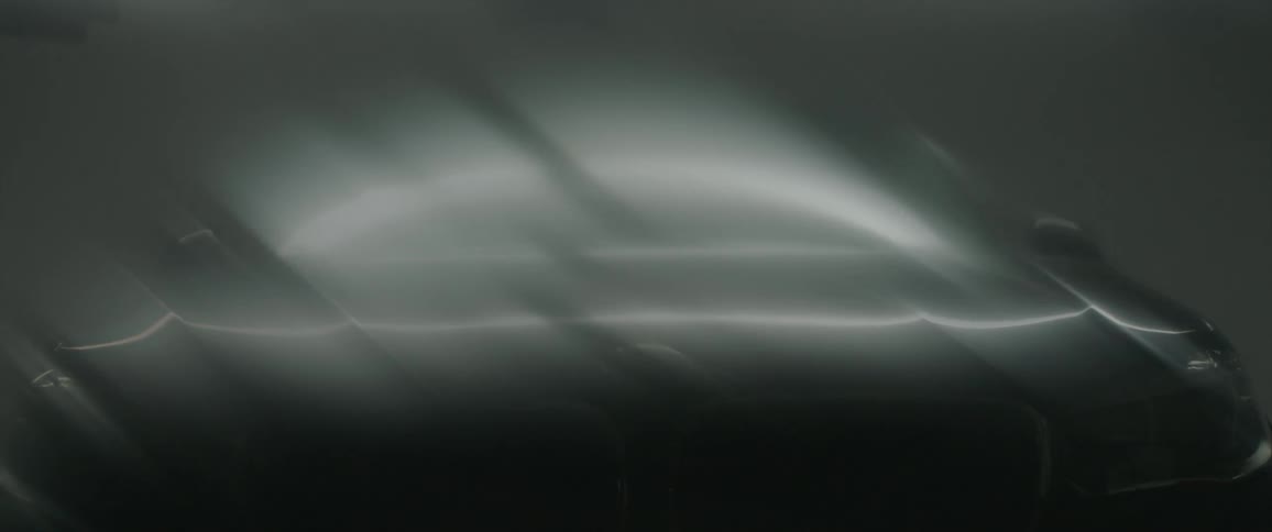Lights reflect from a car windshield