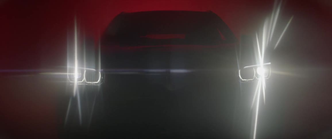 Car shining its headlights in a red background