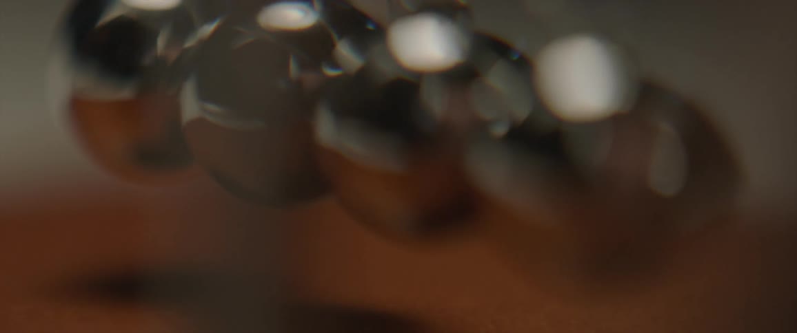 Metal balls swinging and making the others move