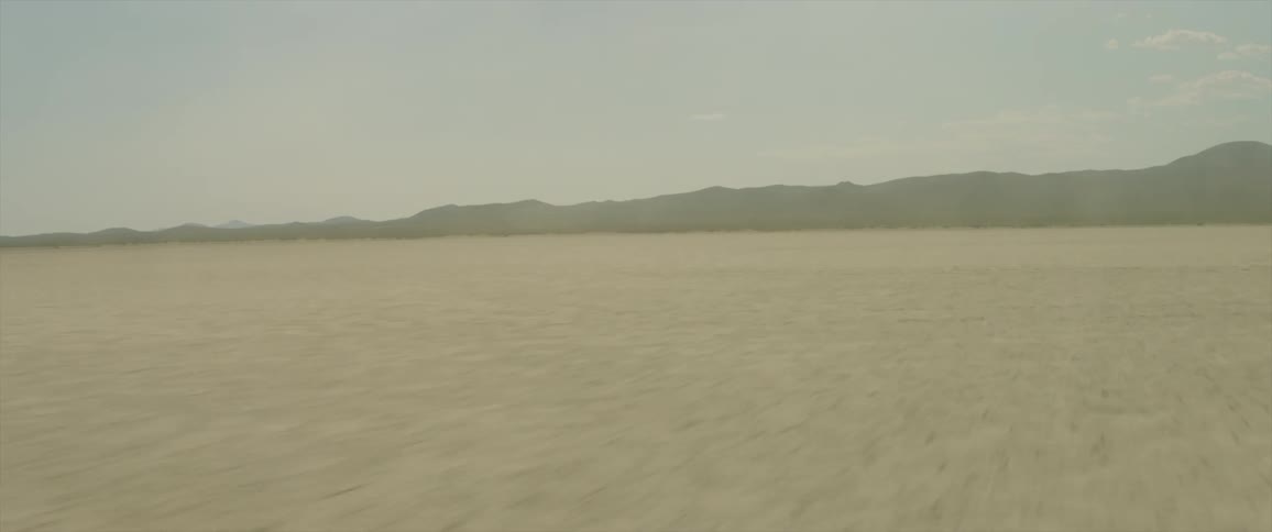 Traveling view over a desert