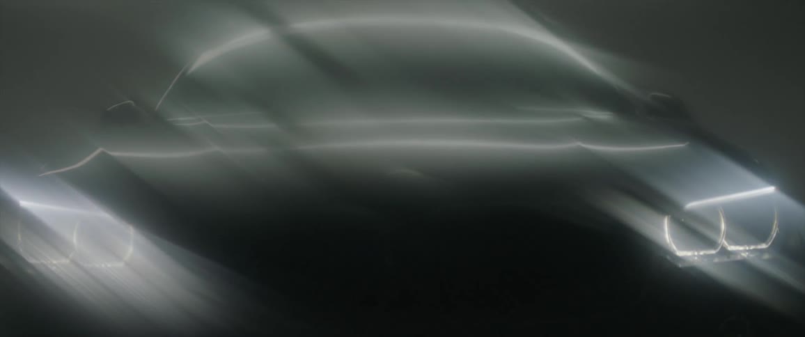 The light slowly reflects off a car