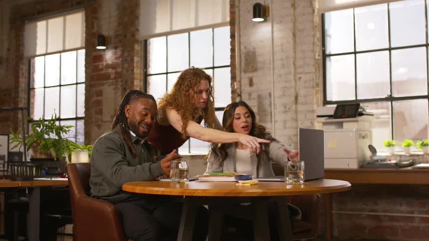 Three coworkers in an office together
