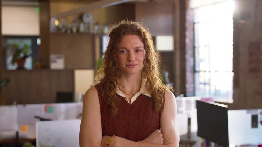 A portrait of a woman standing in a room